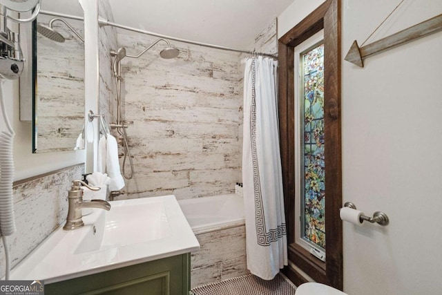 bathroom with vanity and shower / bath combo