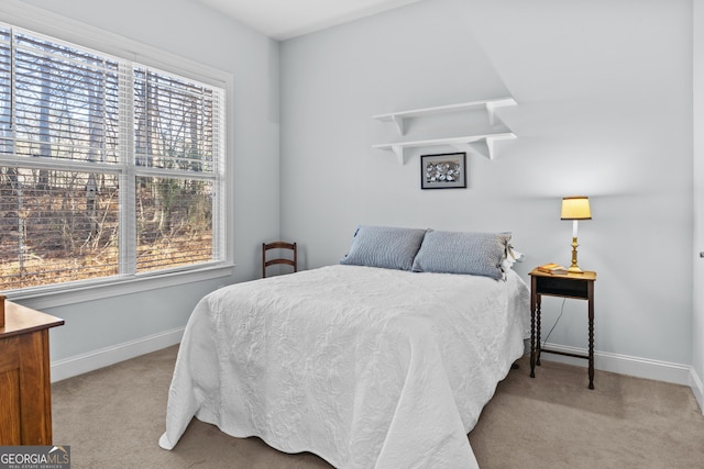 carpeted bedroom featuring multiple windows