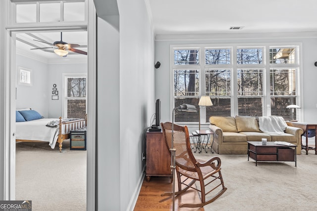 sunroom featuring ceiling fan