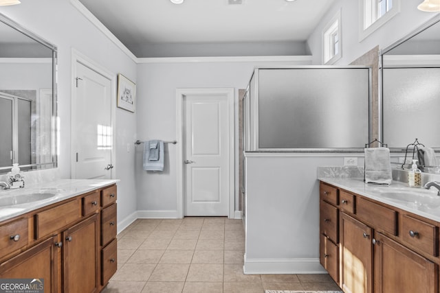 bathroom featuring an enclosed shower, vanity, and tile patterned flooring