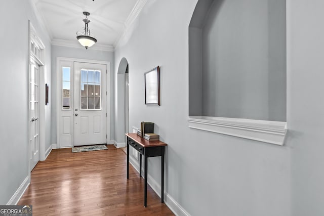 entryway featuring ornamental molding and wood-type flooring