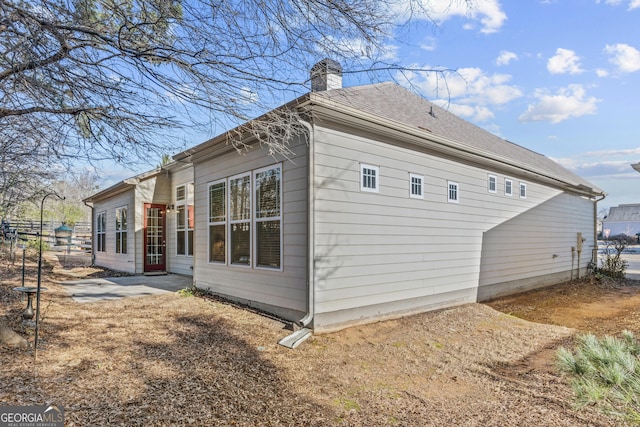 view of property exterior with a patio