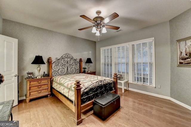 bedroom featuring ceiling fan and hardwood / wood-style floors