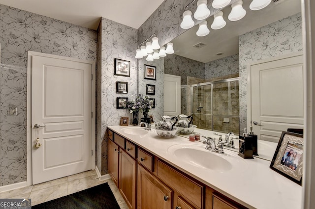 bathroom with vanity, walk in shower, and tile patterned floors