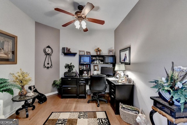 office space with light wood-type flooring and ceiling fan