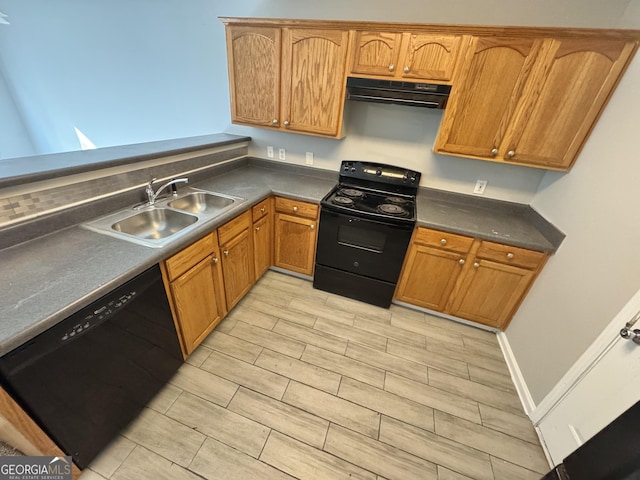 kitchen with sink, black appliances, and extractor fan