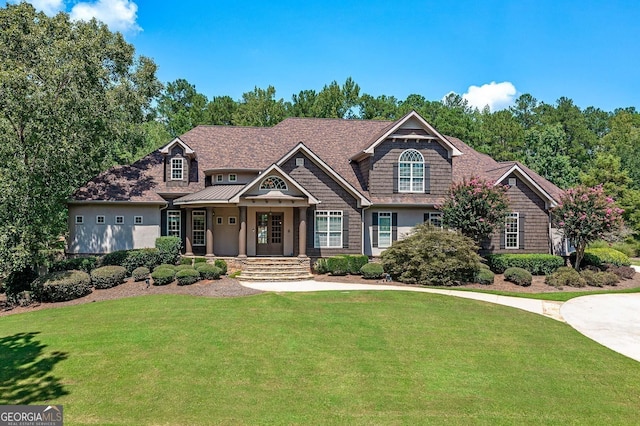 craftsman-style house featuring a front yard and a porch