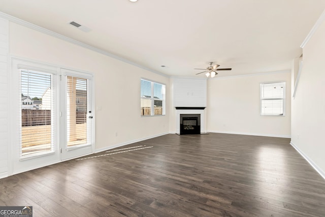 unfurnished living room featuring a fireplace, dark hardwood / wood-style floors, ceiling fan, and ornamental molding