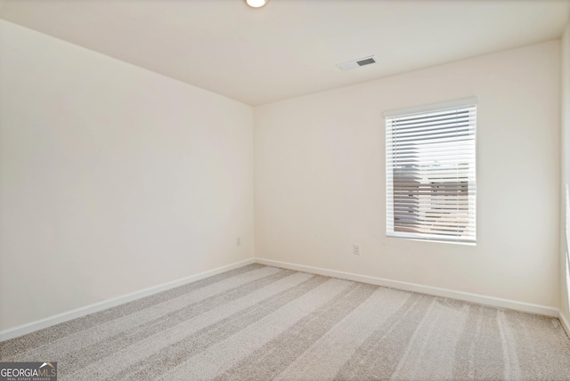 unfurnished room featuring carpet