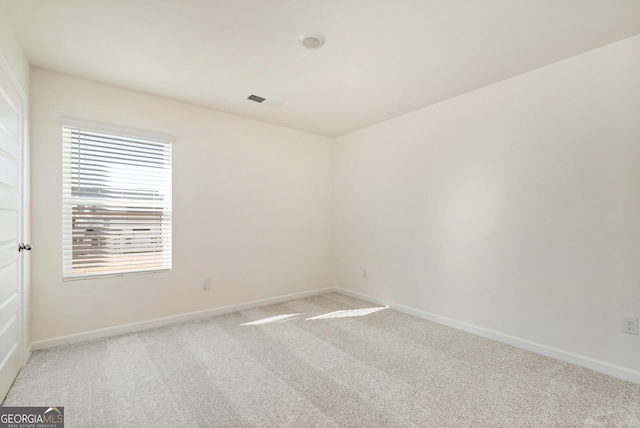 empty room featuring carpet floors