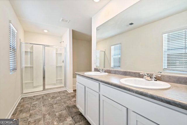 bathroom with vanity and walk in shower