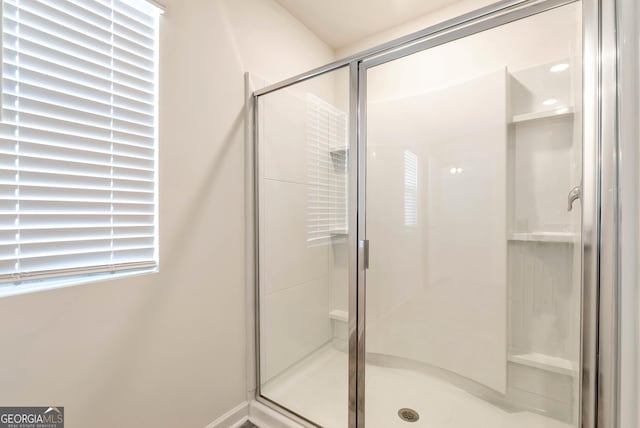 bathroom featuring walk in shower