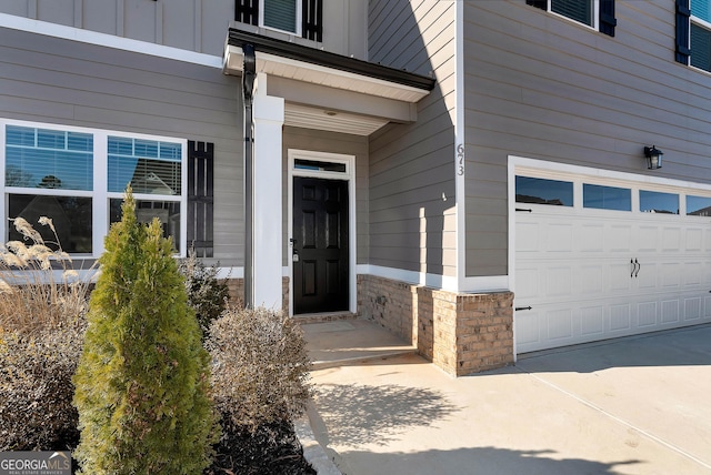 doorway to property featuring a garage