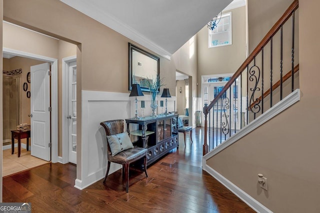 entryway featuring crown molding and wood-type flooring