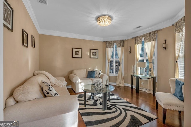 living room with dark hardwood / wood-style flooring, crown molding, and plenty of natural light