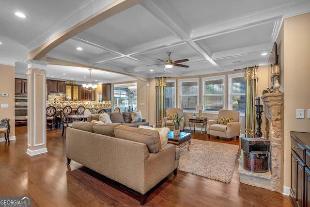 living room with beamed ceiling, a healthy amount of sunlight, coffered ceiling, and decorative columns