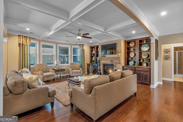 living room featuring coffered ceiling, beam ceiling, crown molding, and dark hardwood / wood-style floors