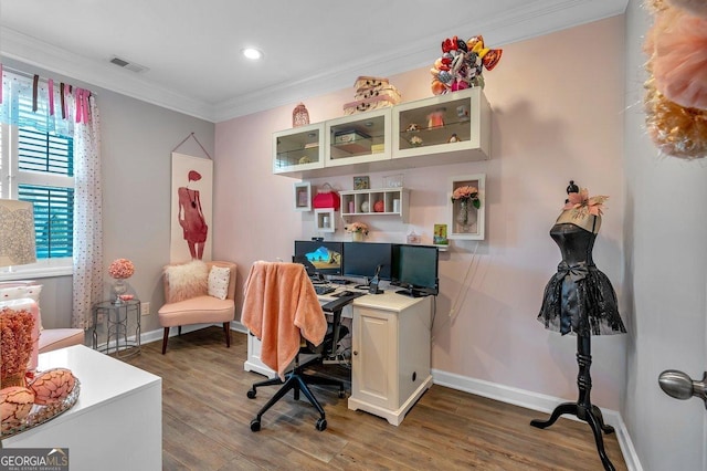 office with hardwood / wood-style floors and crown molding