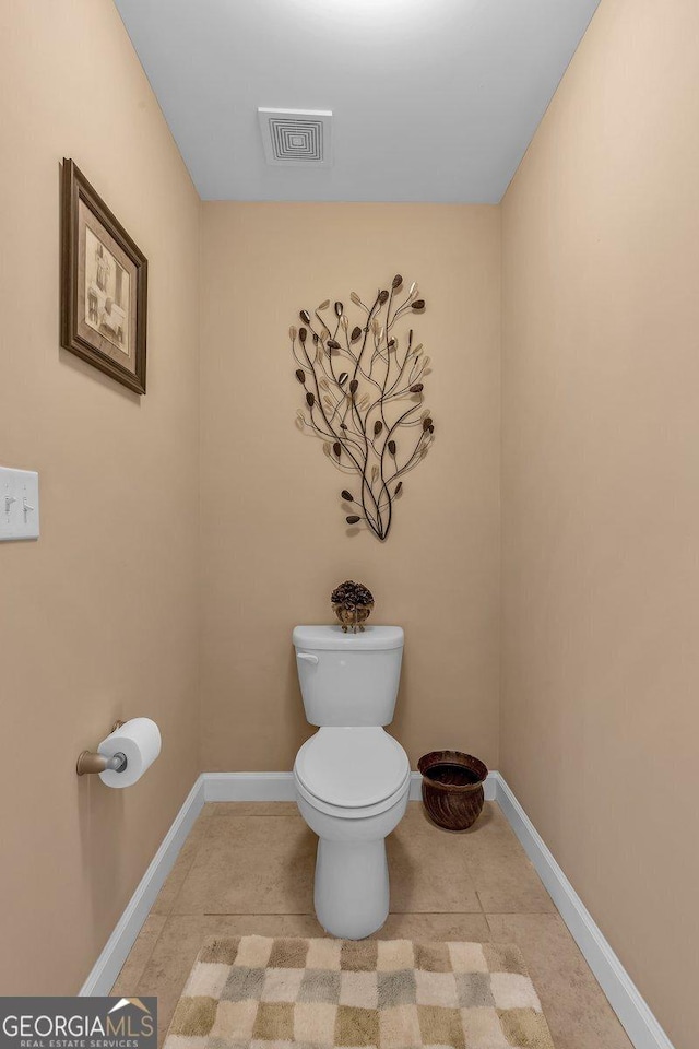 bathroom with tile patterned floors and toilet