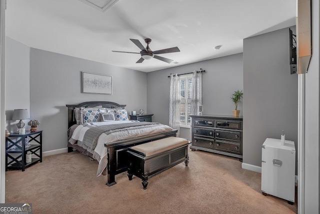 bedroom featuring light carpet and ceiling fan