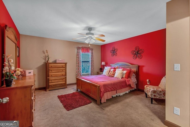 bedroom featuring light colored carpet and ceiling fan