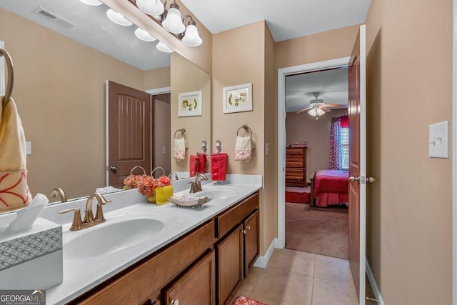 bathroom with ceiling fan, vanity, and tile patterned flooring