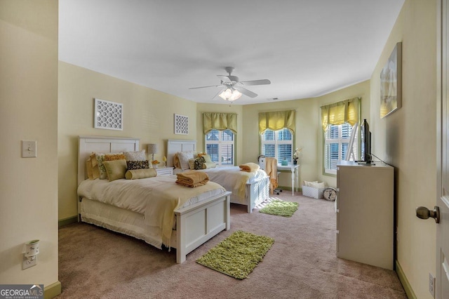 bedroom with light colored carpet and ceiling fan