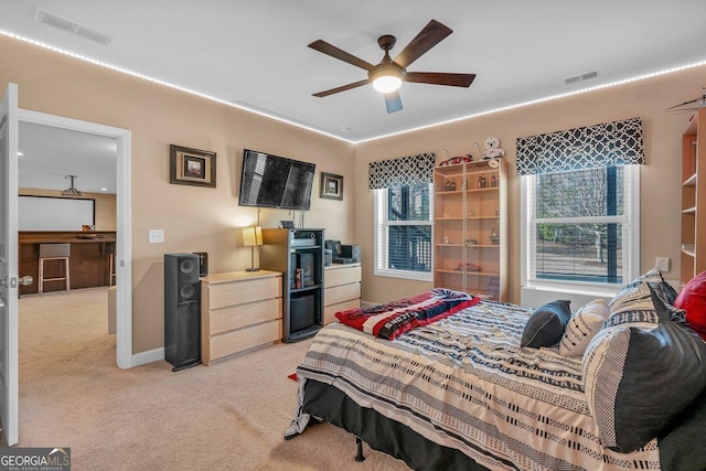 carpeted bedroom with ceiling fan