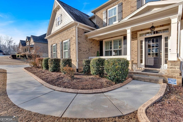 property entrance with covered porch