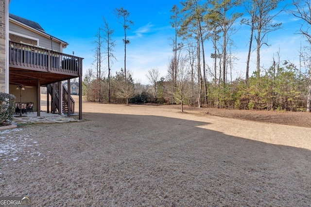 view of yard featuring a wooden deck