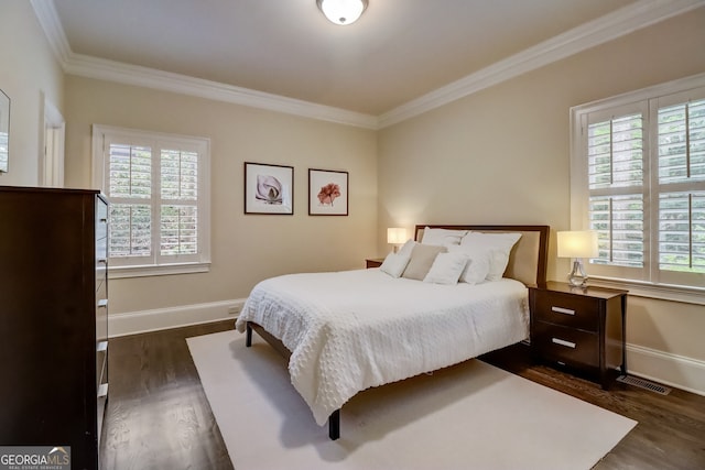 bedroom featuring dark hardwood / wood-style floors and ornamental molding