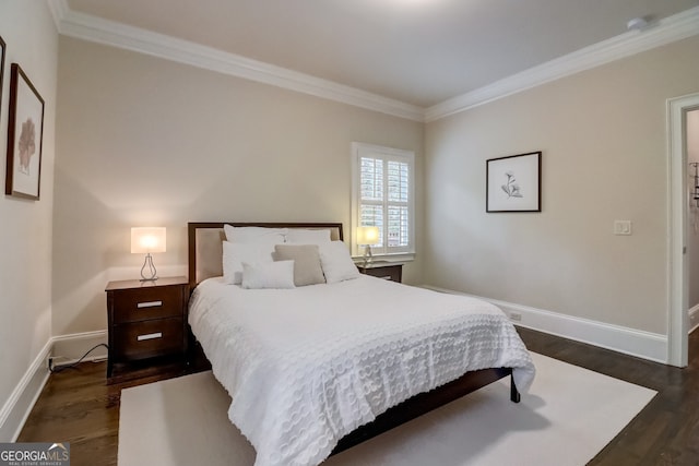 bedroom with crown molding and dark hardwood / wood-style flooring