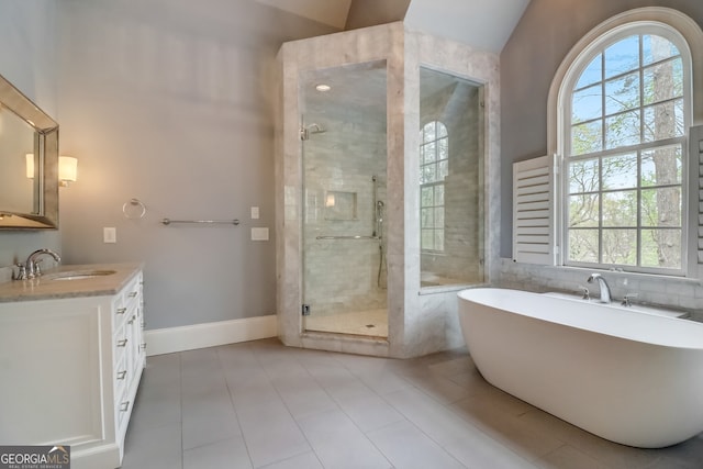 bathroom featuring vanity, shower with separate bathtub, and tile patterned flooring