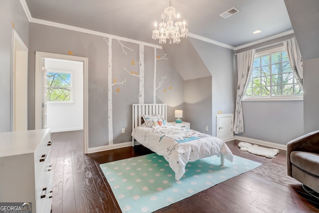 bedroom featuring dark hardwood / wood-style floors, crown molding, and an inviting chandelier