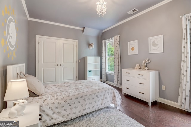 bedroom with dark hardwood / wood-style flooring, a closet, and crown molding