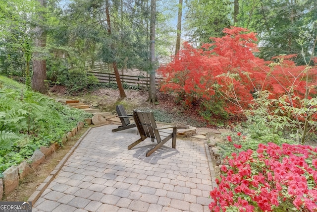 view of patio with an outdoor fire pit