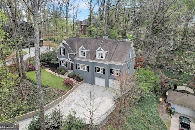 view of front of house with a front yard and a garage