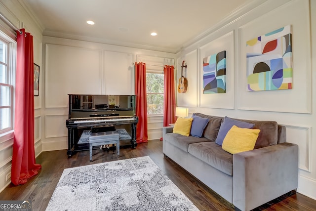 sitting room with dark hardwood / wood-style floors and ornamental molding