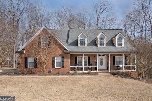 cape cod home with a porch