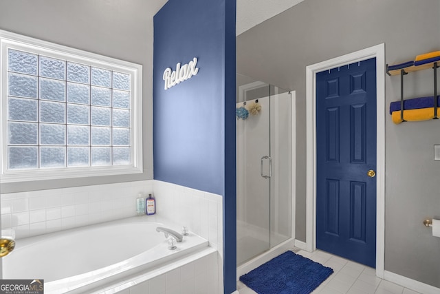 bathroom with tile patterned flooring and plus walk in shower