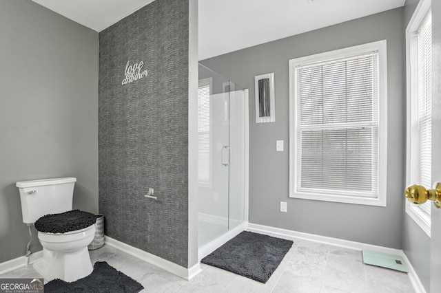 bathroom featuring walk in shower and toilet