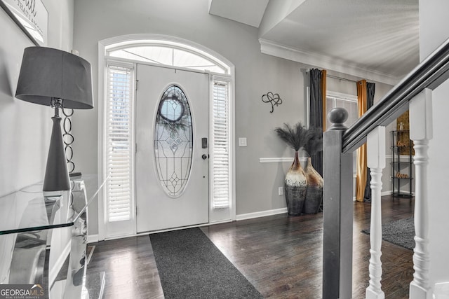 entryway featuring dark hardwood / wood-style flooring and crown molding