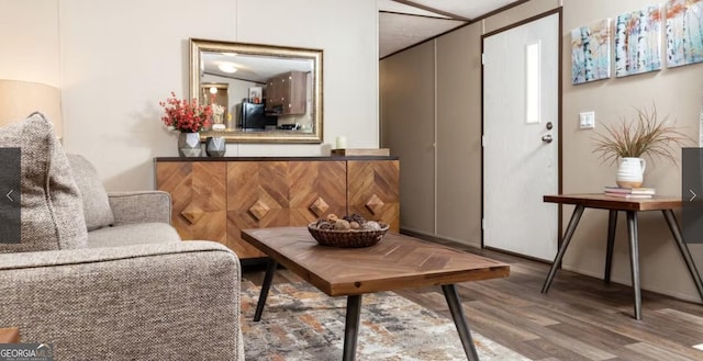 sitting room with hardwood / wood-style floors