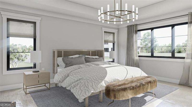 bedroom with light hardwood / wood-style flooring and a chandelier