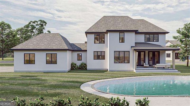 rear view of house featuring a patio area and a lawn