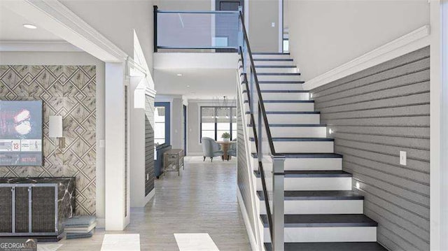 entryway featuring ornamental molding