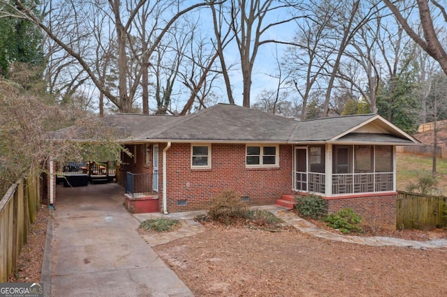 exterior space with a sunroom and a carport