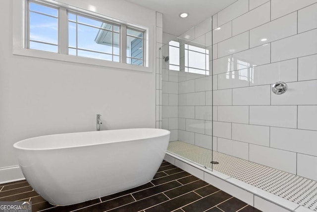 bathroom with separate shower and tub and tile patterned floors