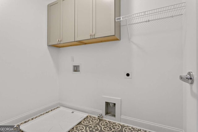 laundry room featuring hookup for a washing machine, cabinets, and hookup for an electric dryer