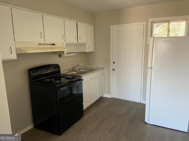 kitchen featuring white cabinetry, black / electric stove, dark hardwood / wood-style flooring, white fridge, and sink